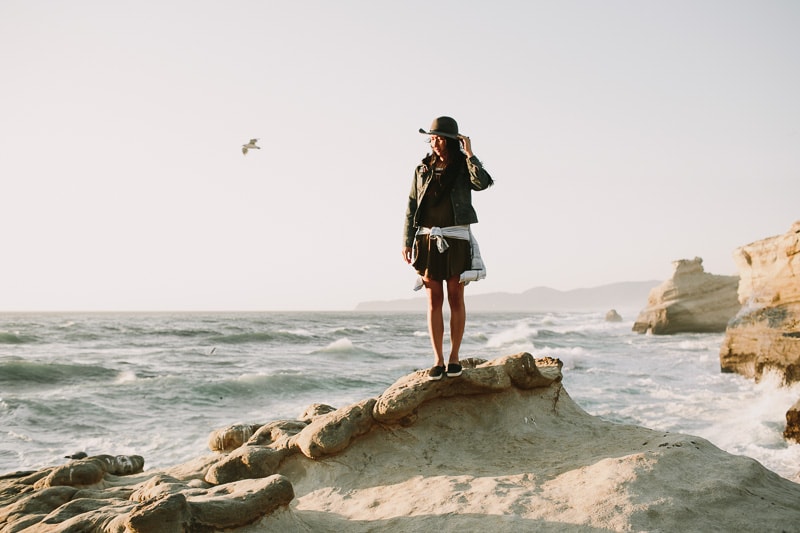 girl standing on rocks