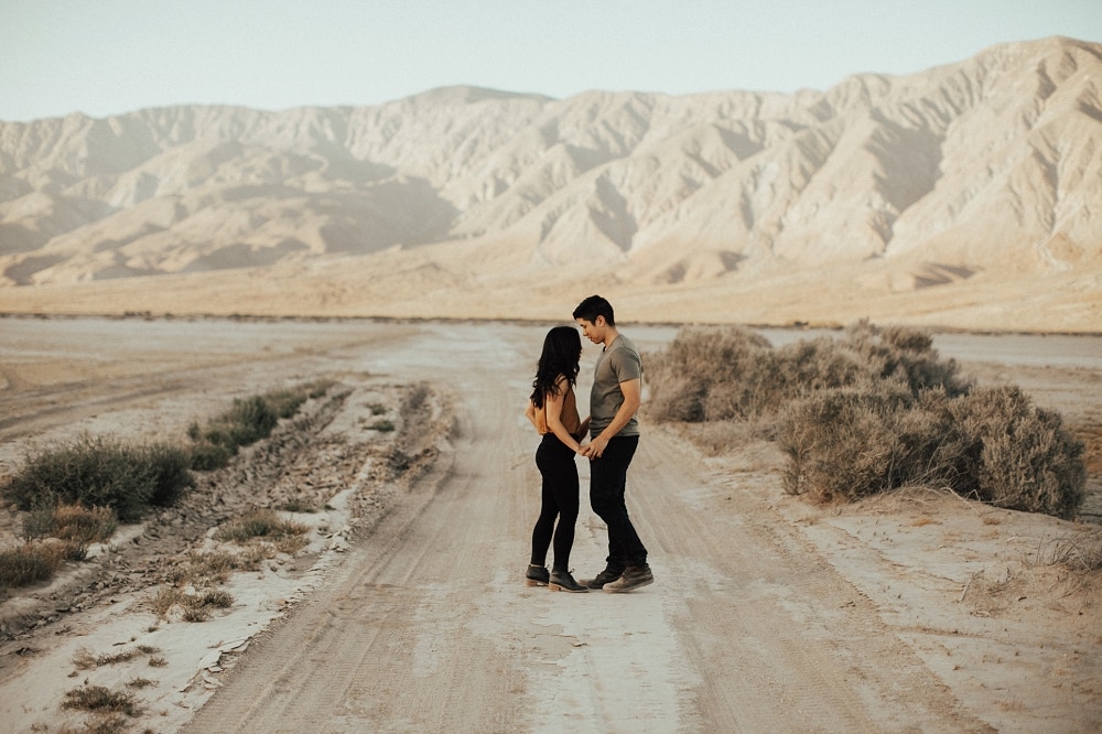 couple on a dry lake bed