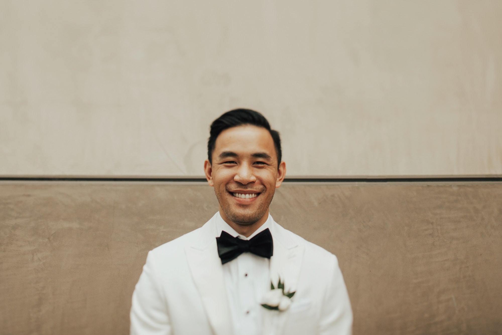 white tux with black bow tie