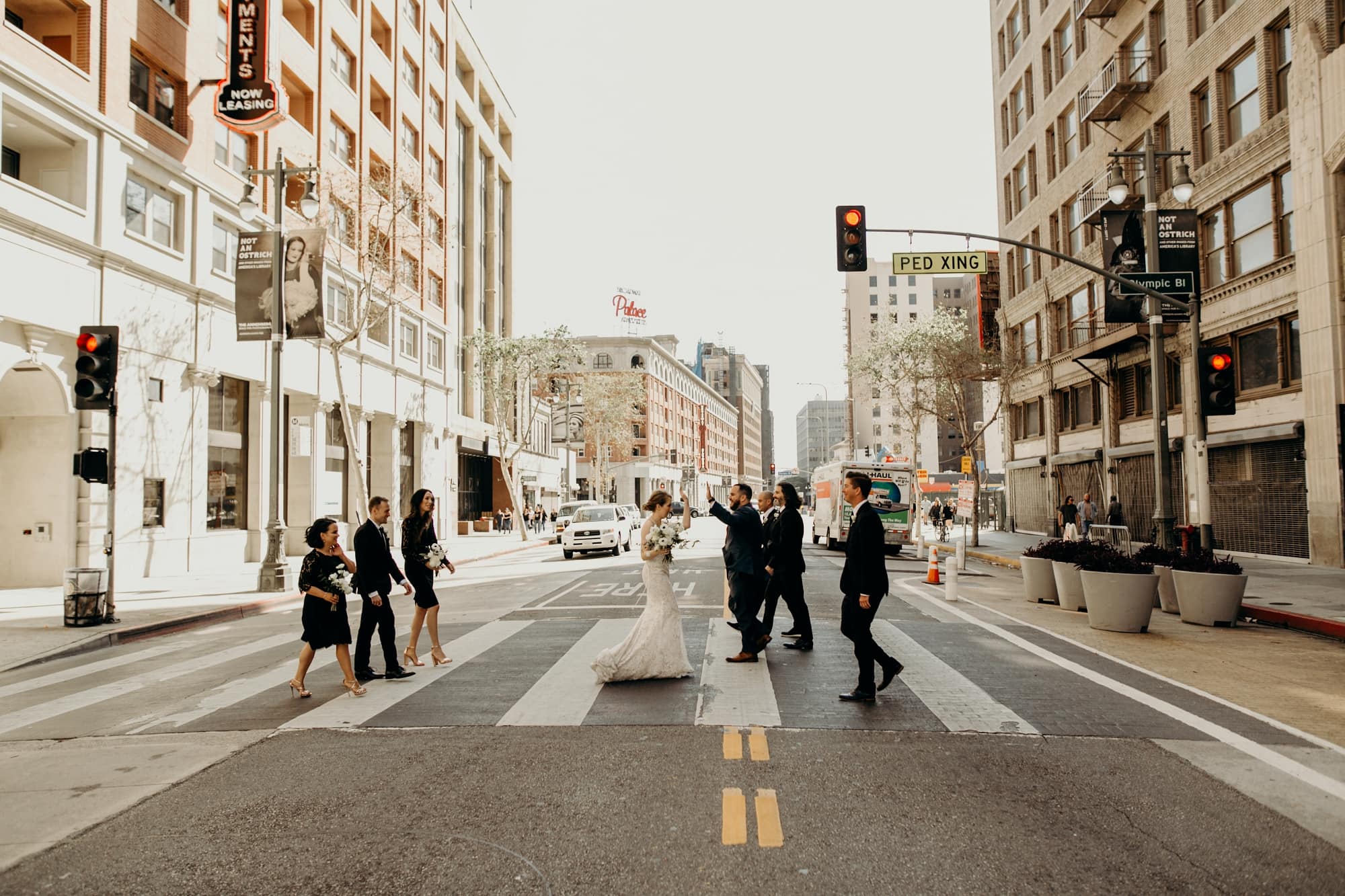 fun wedding party photo crossing the street