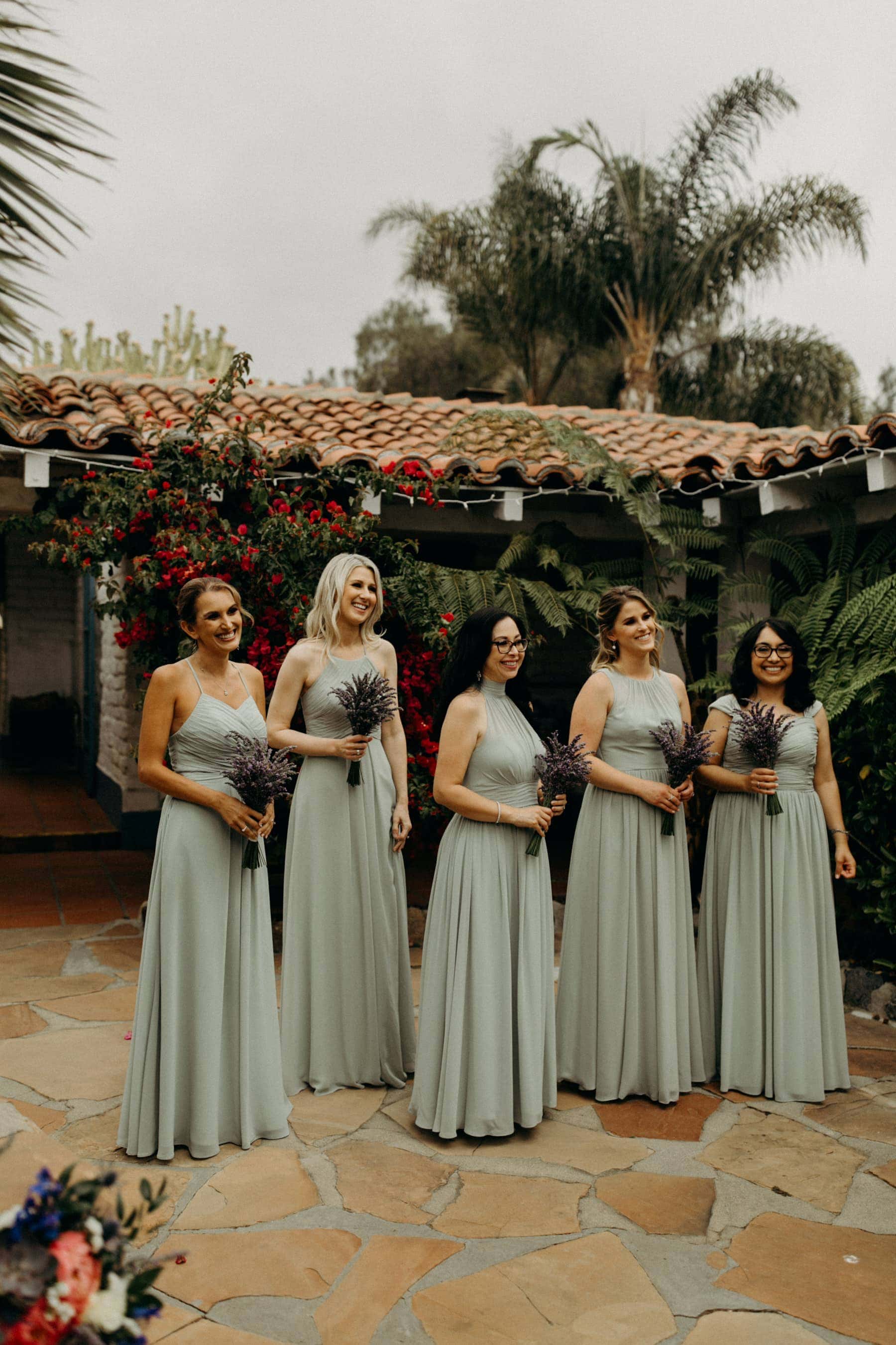 sage bridesmaids dresses with lavender bouquets